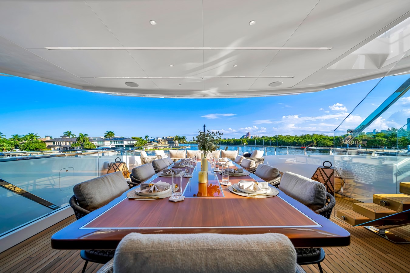 Outdoor dining table set for guests aboard Jules