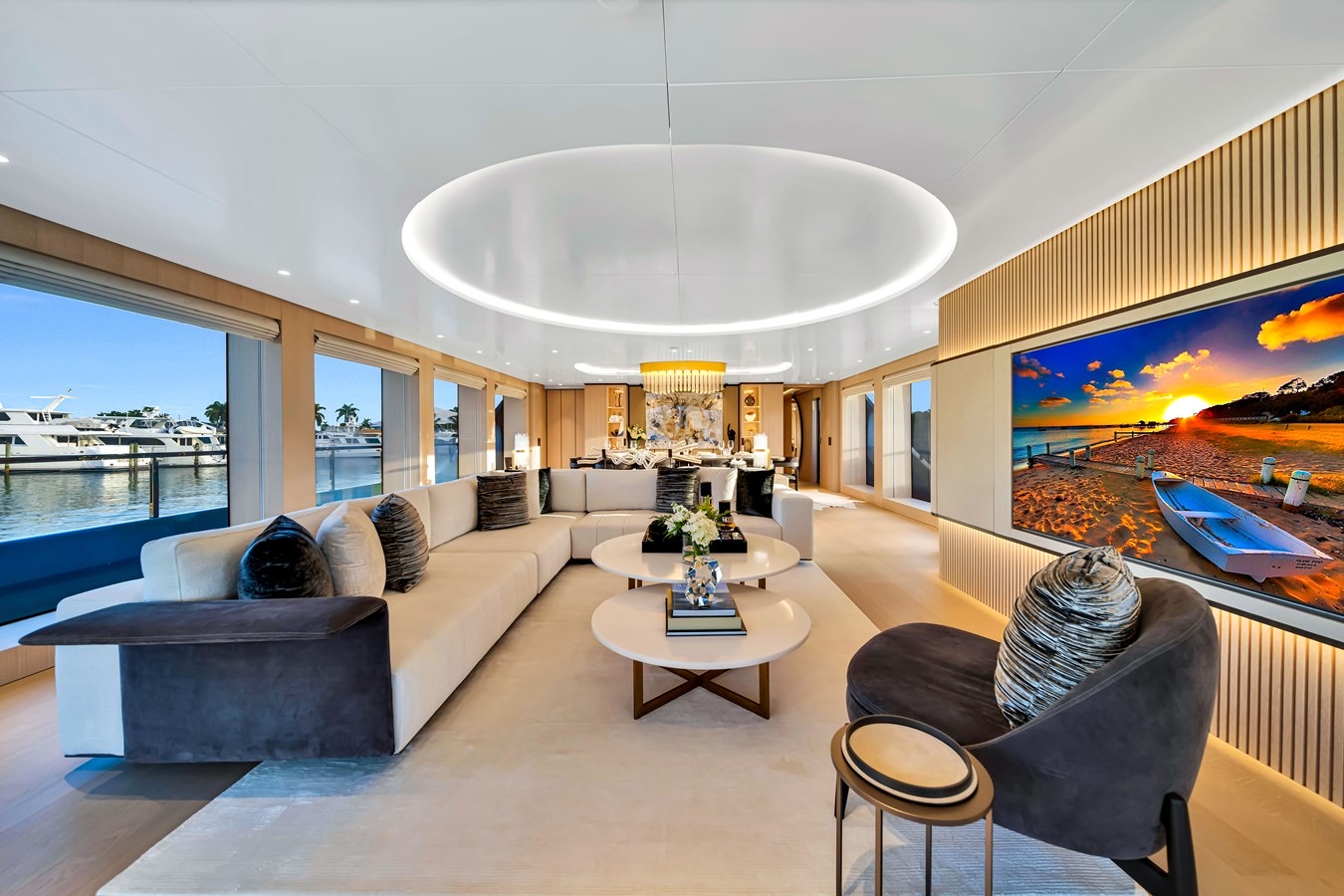 Jules’ light-filled salon with curved seating and a circular ceiling feature